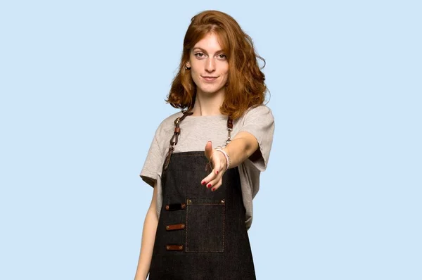 Young Redhead Woman Apron Shaking Hands Closing Good Deal Blue — 图库照片