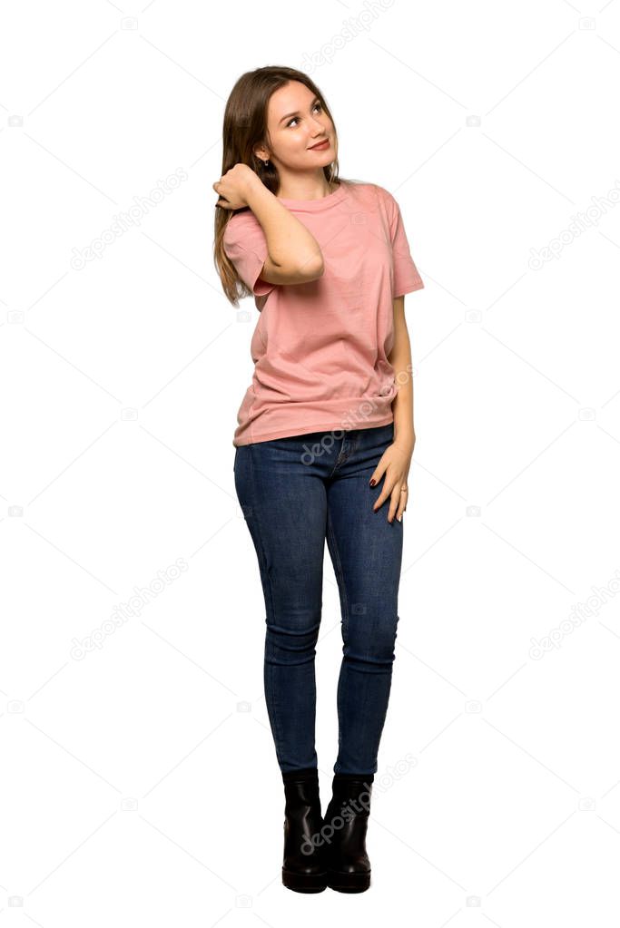 A full-length shot of a Teenager girl with pink sweater having doubts and thinking on isolated white background
