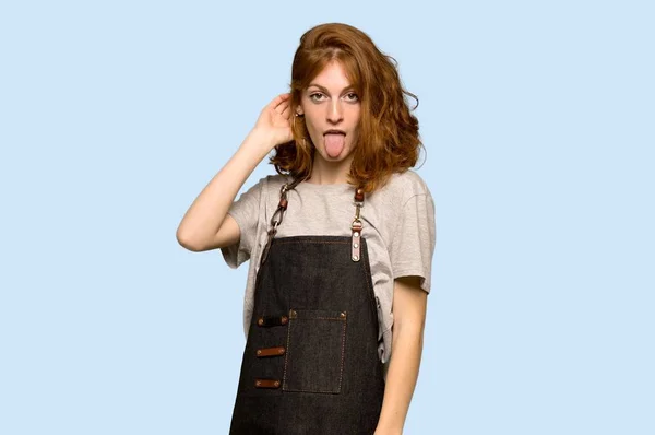 Young Redhead Woman Apron Showing Tongue Camera Having Funny Look — Stock Photo, Image