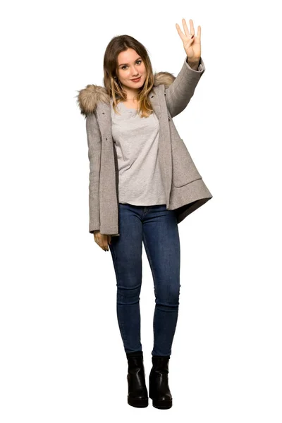 Полнометражный Снимок Девочки Подростка Пальто Счастливой Насчитанной Четырех Пальцами Изолированном — стоковое фото