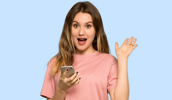 Teenager Girl Pink Sweater Surprised While Sending Message Mobile Isolated — Stock Photo, Image