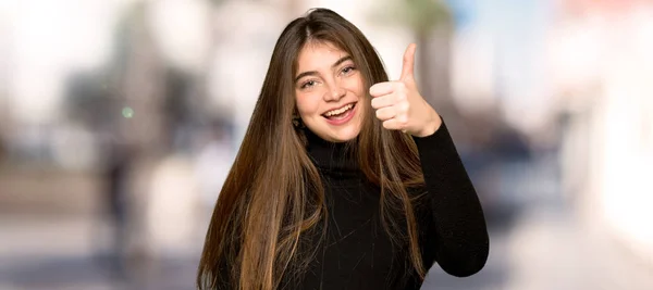 Pretty Girl Giving Thumbs Gesture Because Something Good Has Happened — Stock Photo, Image