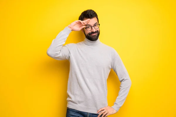 Man Beard Turtleneck Saluting Hand — Stock Photo, Image