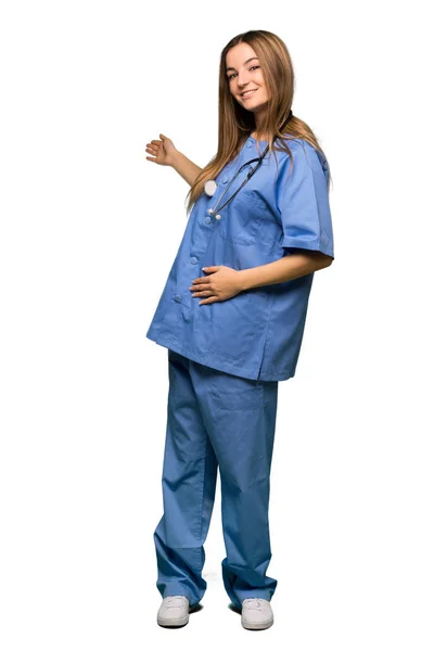 Full Body Young Nurse Pointing Back Presenting Product Isolated Background — Stock Photo, Image