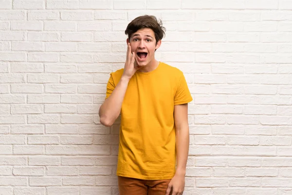 Teenager Man White Brick Wall Surprise Shocked Facial Expression — Stock Photo, Image