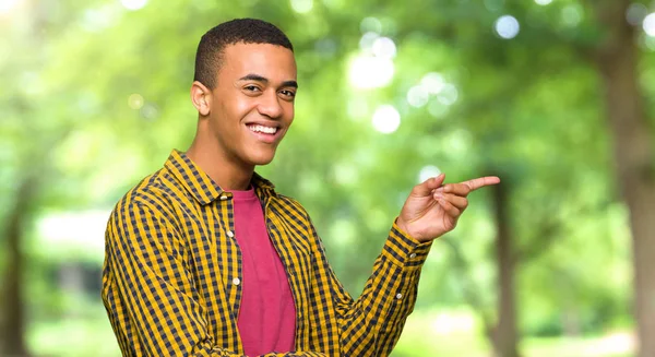 Young Afro American Man Pointing Finger Side Lateral Position Park — Stock Photo, Image