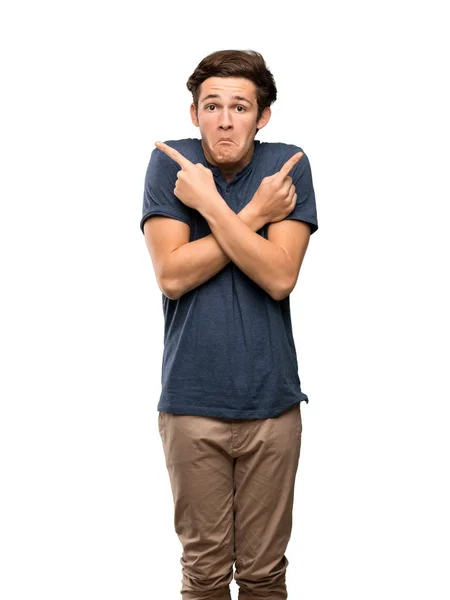 Teenager Man Pointing Laterals Having Doubts Isolated White Background — Stock Photo, Image