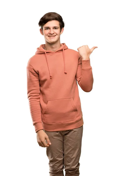 Homme Adolescent Avec Sweat Shirt Pointant Vers Côté Pour Présenter — Photo