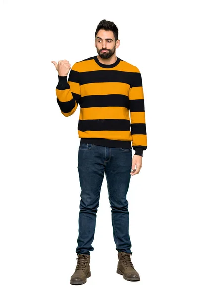 Full Length Shot Handsome Man Striped Sweater Unhappy Pointing Side — Stock Photo, Image