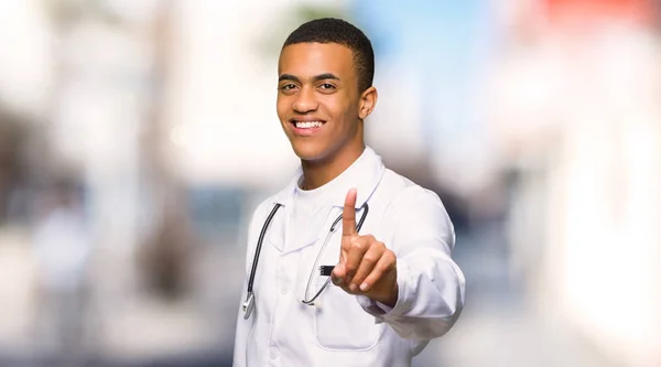 Young Afro American Man Doctor Showing Lifting Finger Outdoors — Stock Photo, Image