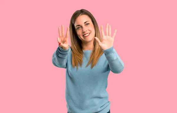 Blonde Woman Blue Shirt Counting Eight Fingers Isolated Pink Background — Stock Photo, Image