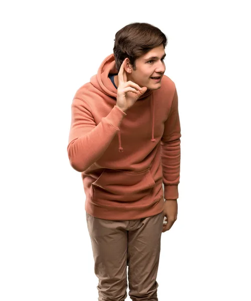 Hombre Adolescente Con Sudadera Escuchando Algo Poniendo Mano Oreja Sobre —  Fotos de Stock