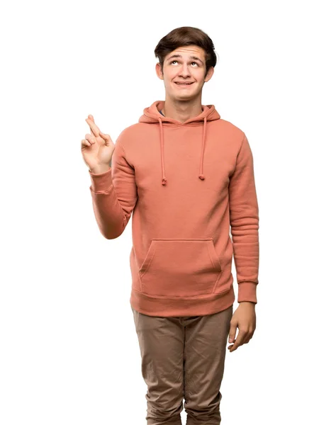 Teenager Mann Mit Sweatshirt Mit Daumendrücken Und Guten Wünschen Vor — Stockfoto