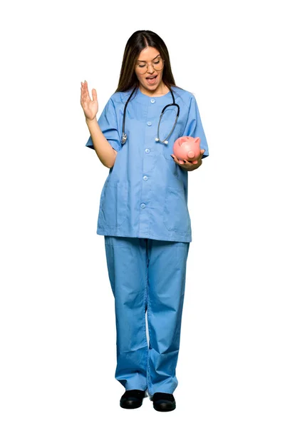 Full Body Young Nurse Holding Big Piggybank — Stock Photo, Image