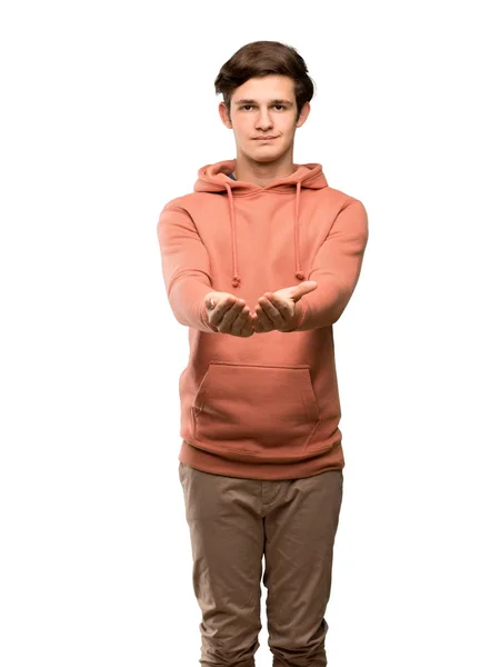 Homme Adolescent Avec Sweat Shirt Tenant Copyspace Imaginaire Sur Paume — Photo