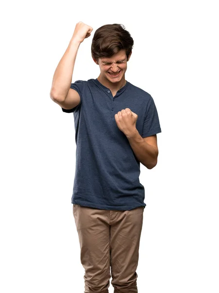 Hombre Adolescente Celebrando Una Victoria Sobre Fondo Blanco Aislado — Foto de Stock