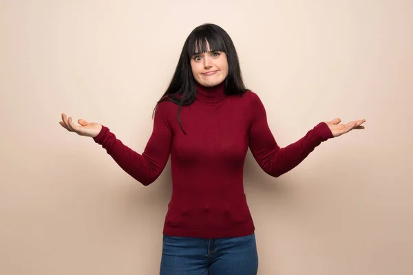 Young Woman Red Turtleneck Having Doubts While Raising Hands Shoulders — Stock Photo, Image