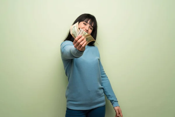 Young Woman Green Wall Taking Lot Money — Stock Photo, Image