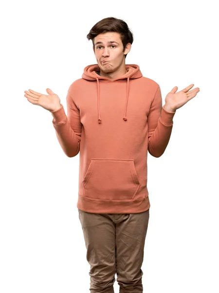 Teenager Man Sweatshirt Having Doubts While Raising Hands Isolated White — Stock Photo, Image