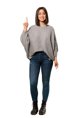 Genç bir kadın gösteren ve en iyi iz izole beyaz arka plan üzerinde parmak kaldırma tam uzunlukta bir kadeh