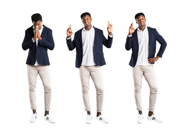 Set of Handsome african american man wearing a jacket keeps palm and with fingers crossing — Stock Photo, Image