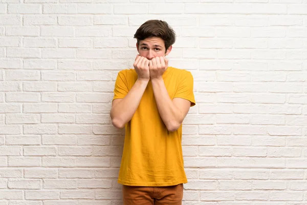 Teenager Man White Brick Wall Nervous Scared Putting Hands Mouth — Stock Photo, Image