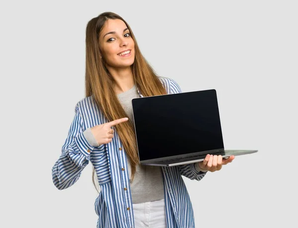 Young Girl Striped Shirt Showing Laptop Isolated Grey Background — Stock Photo, Image
