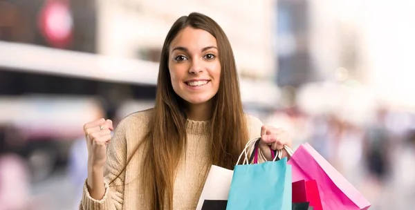 Young Girl Shopping Bags Celebrating Victory Winner Position City — Stock Photo, Image