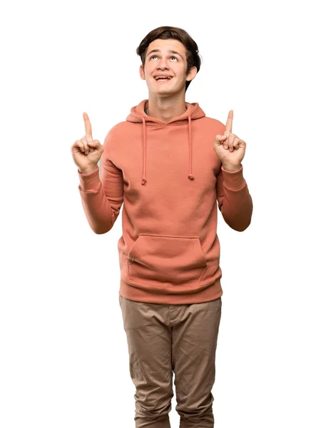 Tonåringen Man Med Sweatshirt Förvånade Och Pekar Uppåt Över Isolerade — Stockfoto