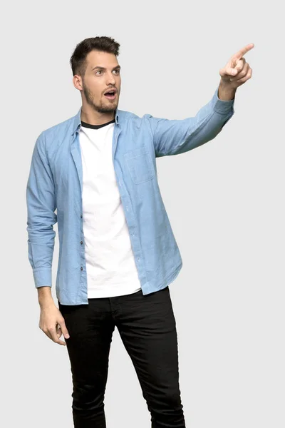Handsome Man Pointing Away Grey Background — Stock Photo, Image
