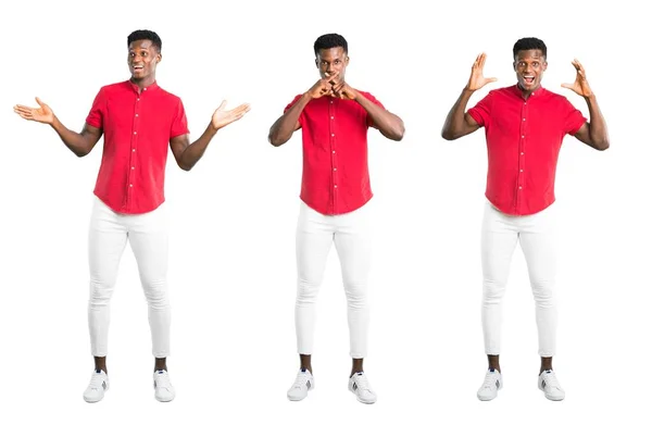 Készlet-ból fiatal afroamerikai férfi meglepetés és döbbent arckifejezés — Stock Fotó