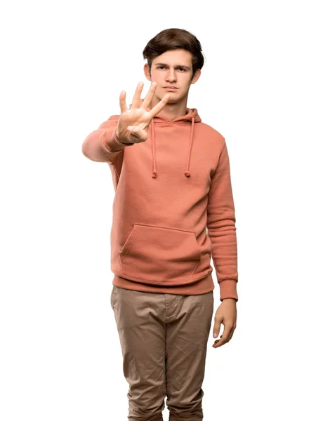 Έφηβο Άνθρωπος Ευτυχισμένη Και Μετρώντας Τέσσερις Φούτερ Δάχτυλα Πάνω Από — Φωτογραφία Αρχείου
