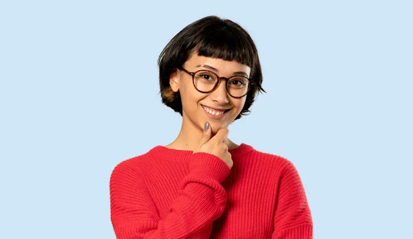 Short Hair Girl Red Sweater Glasses Smiling Isolated Blue Background — Stock Photo, Image