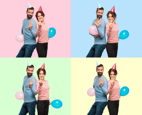 Set of couple with balloons and birthday hats counting two, three, four and five with fingers