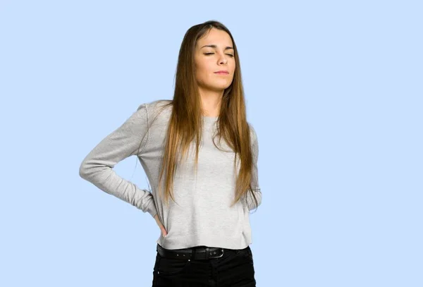 Young Girl Suffering Backache Having Made Effort Blue Background — Stock Photo, Image