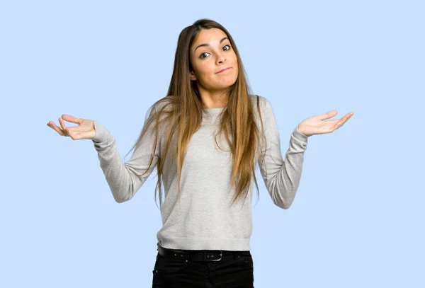 Young Girl Making Unimportant Gesture While Lifting Shoulders Blue Background — Stock Photo, Image