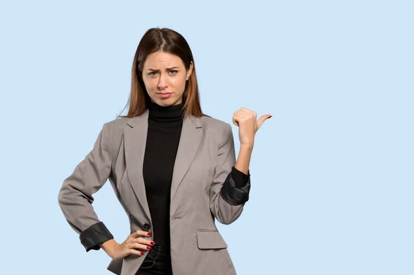 Business Woman Unhappy Pointing Side Isolated Blue Background — Stock Photo, Image