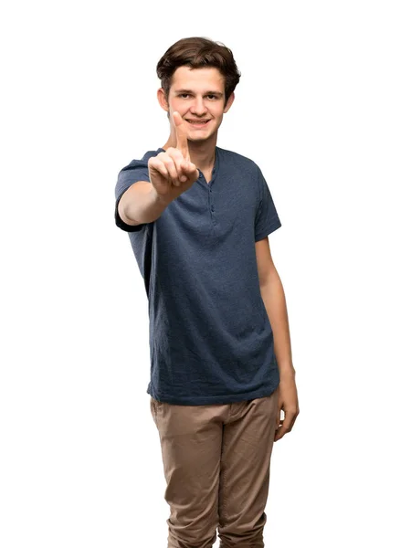 Adolescente Homem Mostrando Levantando Dedo Sobre Fundo Branco Isolado — Fotografia de Stock