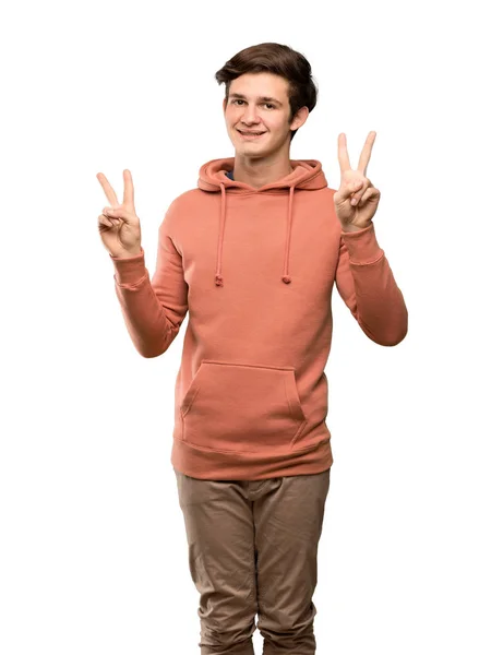 Tonåringen Man Med Sweatshirt Leende Och Visar Seger Tecken Med — Stockfoto