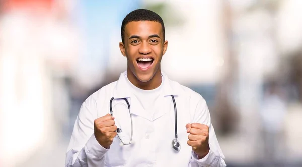 Young Afro American Man Doctor Celebrating Victory Winner Position Outdoors — Stock Photo, Image