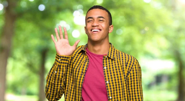 Young Afro American Man Saluting Hand Happy Expression Park — Stock Photo, Image