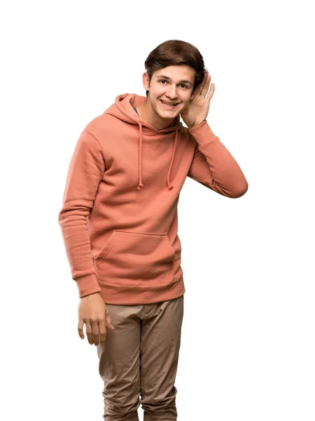 Teenager Man Sweatshirt Listening Something Putting Hand Ear Isolated White — Stock Photo, Image