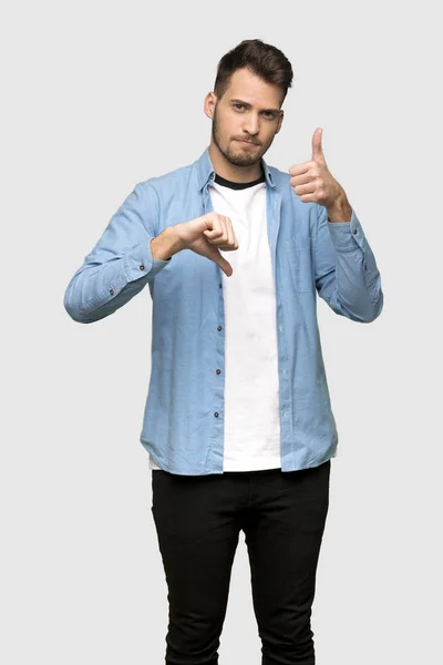 Handsome Man Making Good Bad Sign Undecided Yes Grey Background — Stock Photo, Image