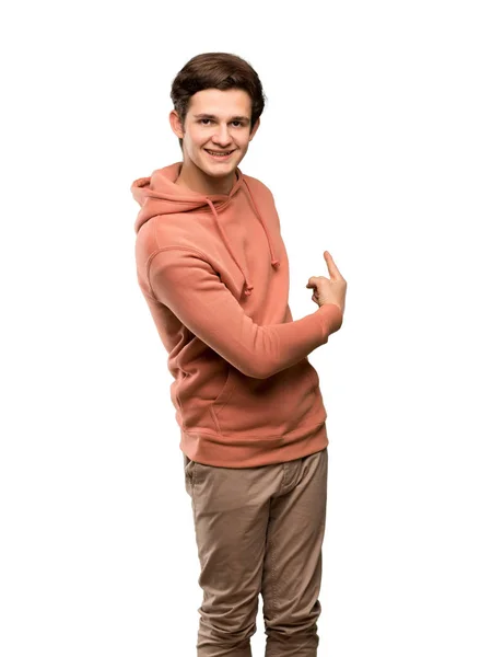 Tiener Man Met Sweatshirt Wijzen Terug Geïsoleerde Witte Achtergrond — Stockfoto