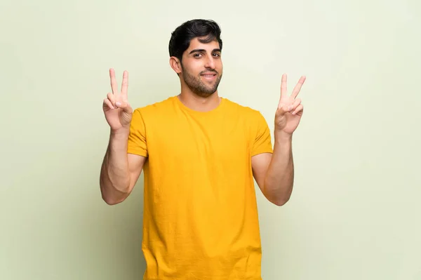 Young Man Pink Wall Smiling Showing Victory Sign Both Hands — Stock Photo, Image