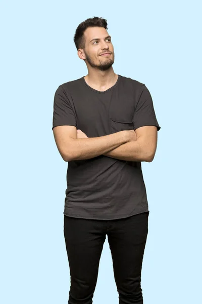 Man Black Shirt Looking While Smiling Blue Background — Stock Photo, Image