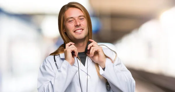 Doctor man with headphones in a hospital