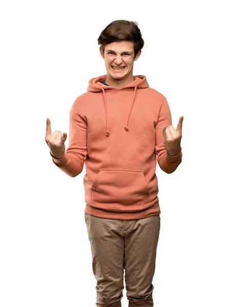 Adolescente Homem Com Camisola Fazendo Gesto Rock Sobre Fundo Branco — Fotografia de Stock