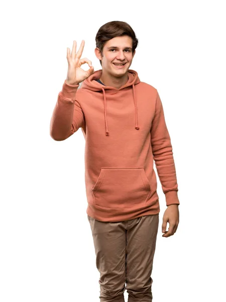 Tiener Man Met Sweatshirt Tonen Teken Met Vingers Geïsoleerde Witte — Stockfoto