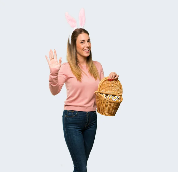 Young Woman Wearing Bunny Ears Easter Holidays Saluting Hand Happy — Stock Photo, Image